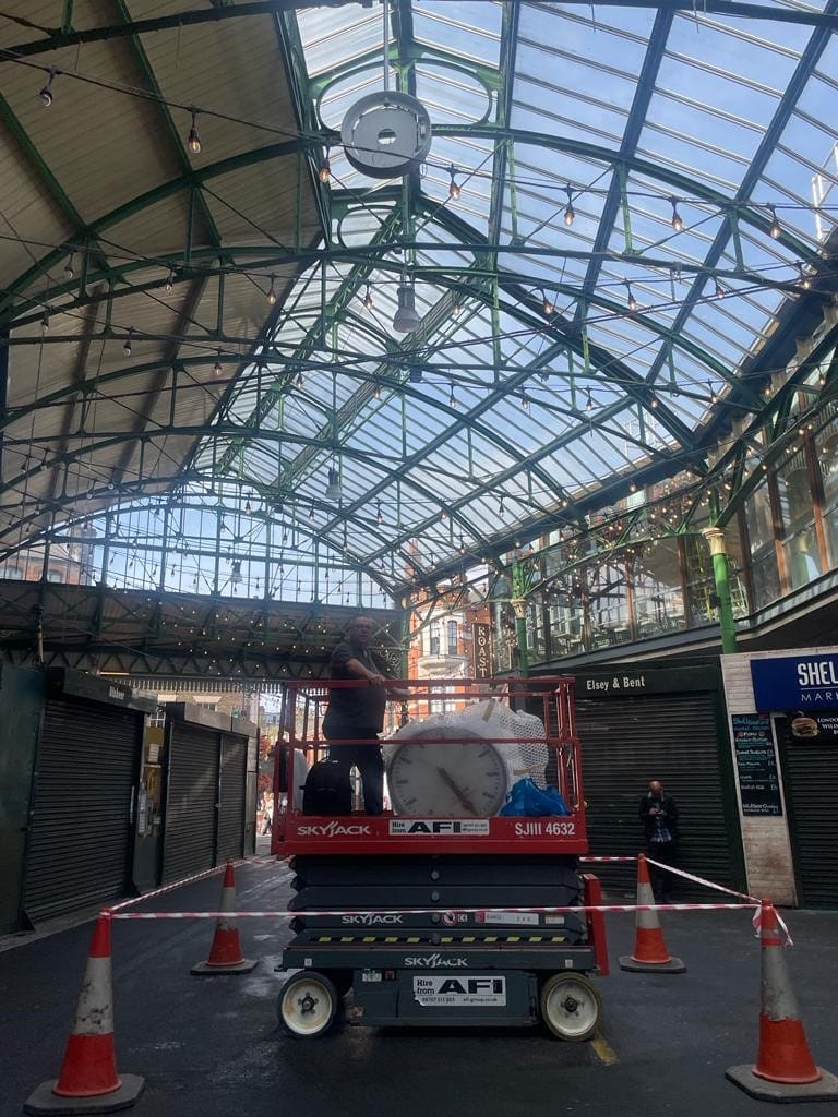 Scissor lift in use at Borough Market